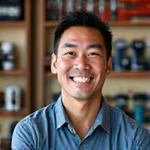 Portrait of Mike, a cheerful Angler's Edge team member, holding a large caught fish.